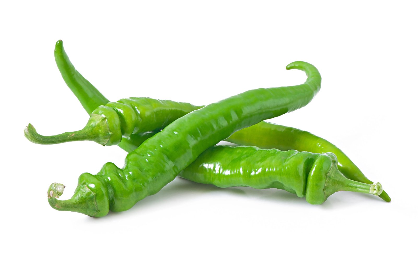 Green chili peppers on background